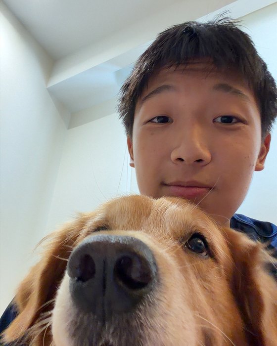 Sam Chang with his golden retriever